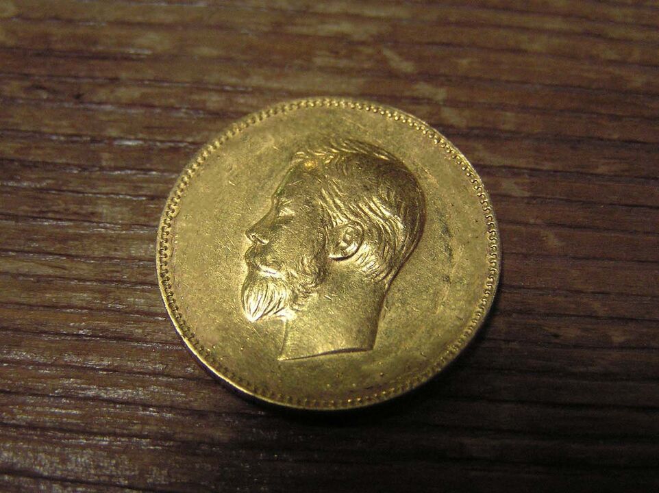 moeda de ouro para o bem-estar financeiro